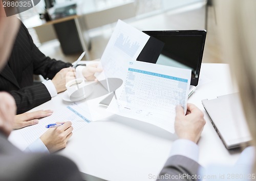 Image of close up of files and laptop computer in office