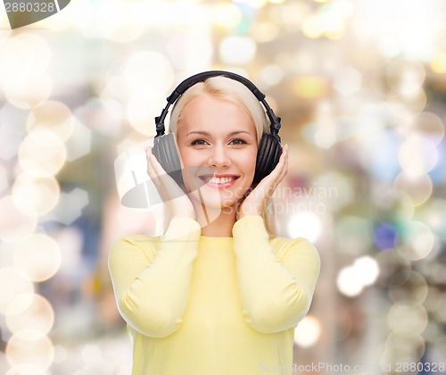 Image of smiling young woman with headphones