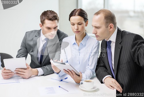 Image of business team with tablet pc having discussion