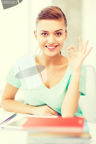 Image of smiling student girl with tablet pc