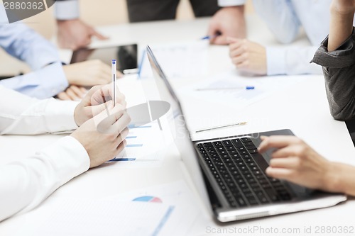 Image of close up of files and laptop computer in office