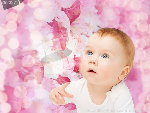 Image of curious baby looking up