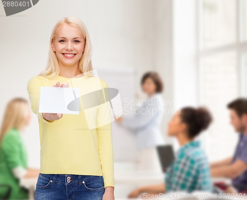 Image of smiling girl with blank business or name card