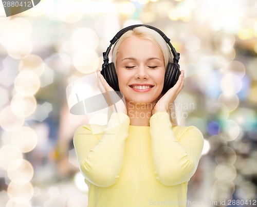 Image of smiling young woman with headphones