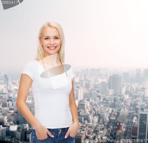 Image of smiling woman in blank white t-shirt