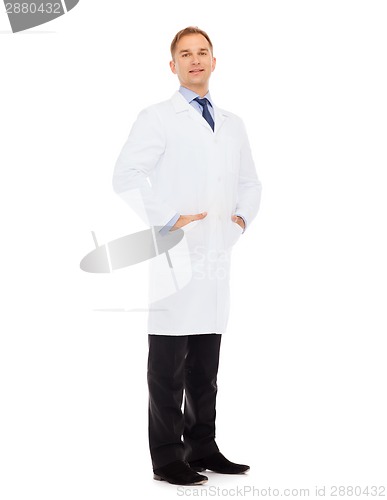 Image of smiling male doctor in white coat