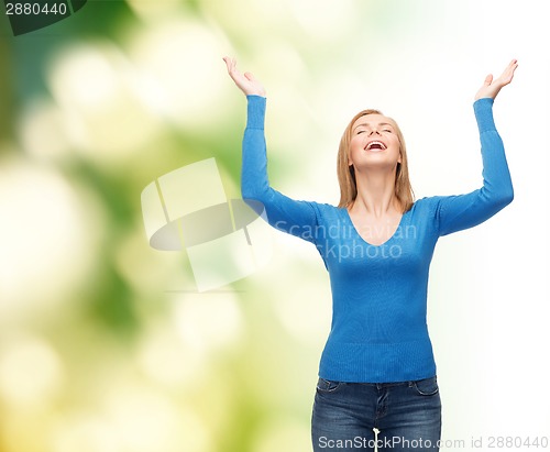 Image of laughing young woman waving hands