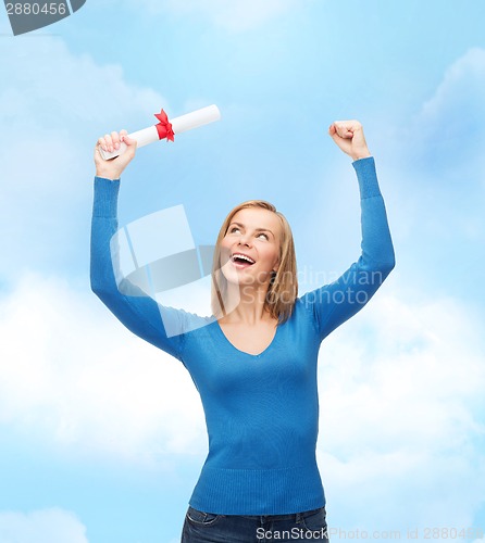 Image of smiling woman with diploma