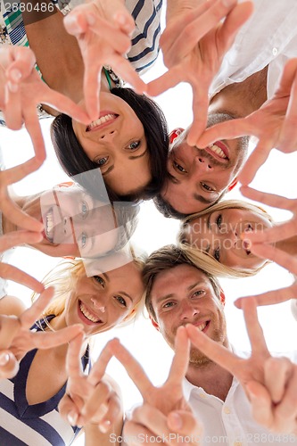 Image of smiling friends in circle