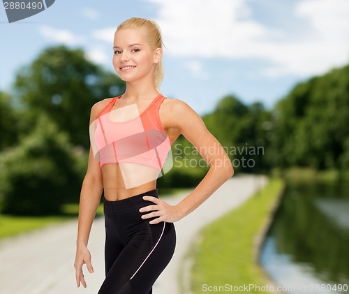 Image of beautiful athletic woman in sportswear