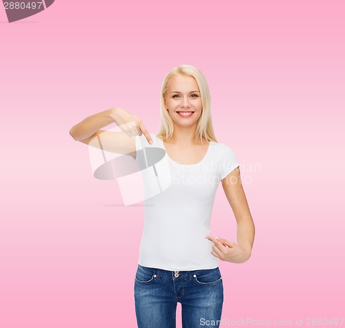 Image of smiling young woman in blank white t-shirt