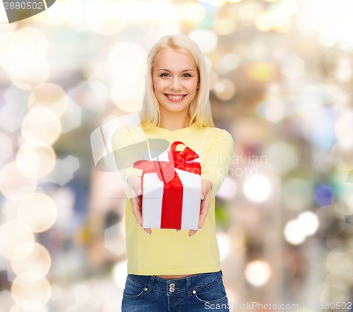 Image of smiling girl with gift box