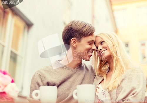 Image of romantic happy couple in the cafe