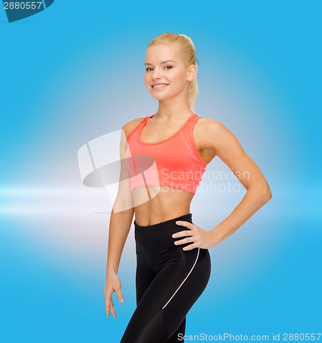 Image of beautiful athletic woman in sportswear
