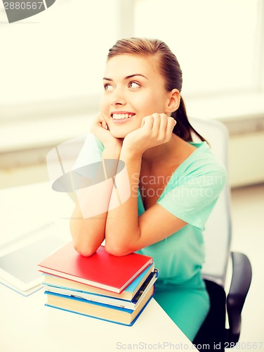 Image of happy smiling student girl with books