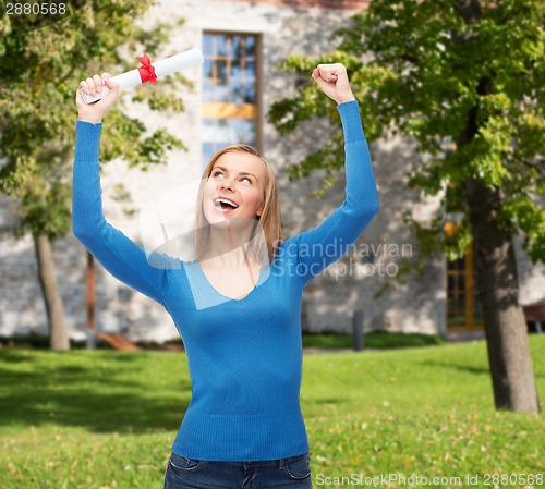 Image of smiling woman with diploma