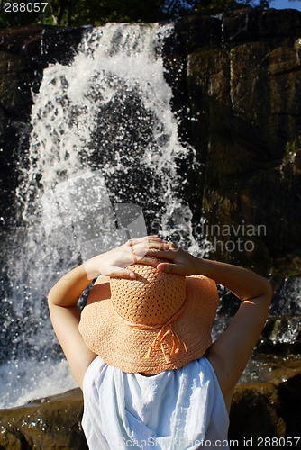 Image of Woman near waterfall