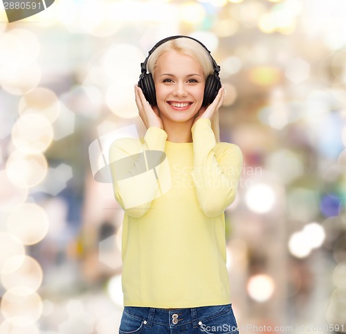 Image of smiling young woman with headphones