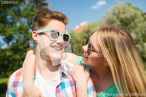 Image of smiling couple having fun outdoors