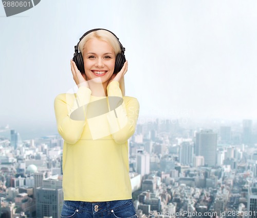 Image of smiling young woman with headphones