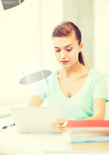 Image of smiling student girl with tablet pc