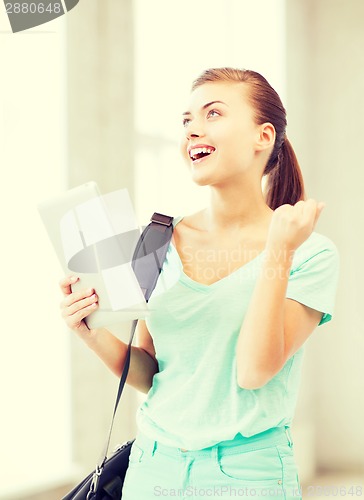 Image of happy student girl with tablet pc