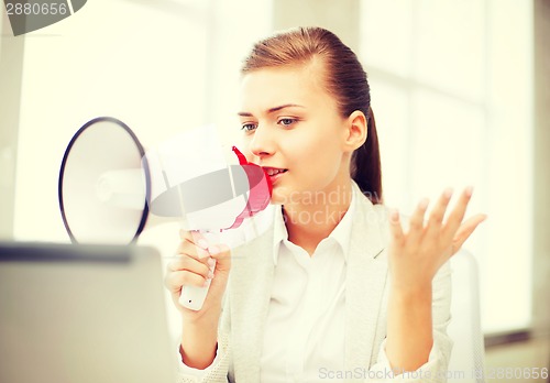 Image of strict businesswoman shouting in megaphone