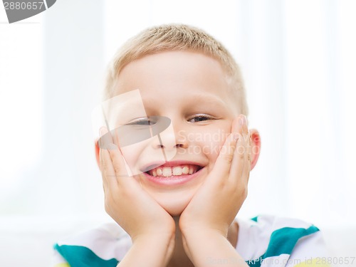 Image of smiling little student boy at home