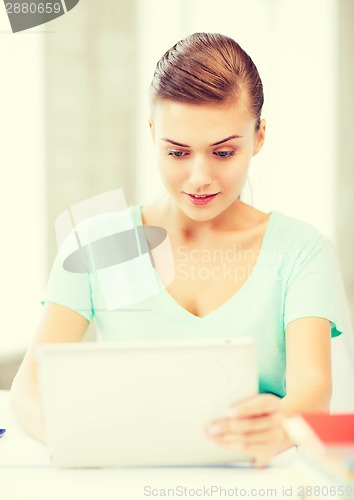 Image of smiling student girl with tablet pc