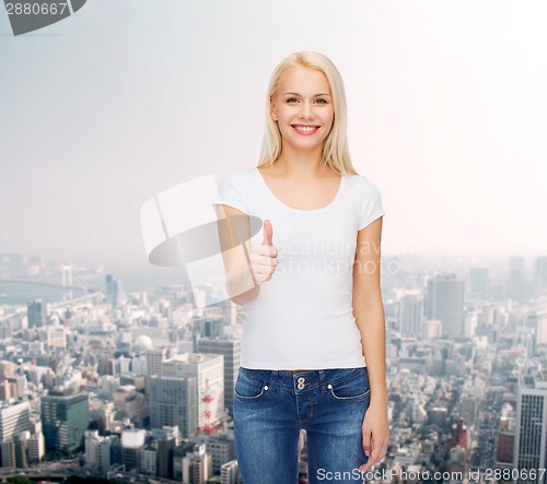 Image of woman showing thumbs up