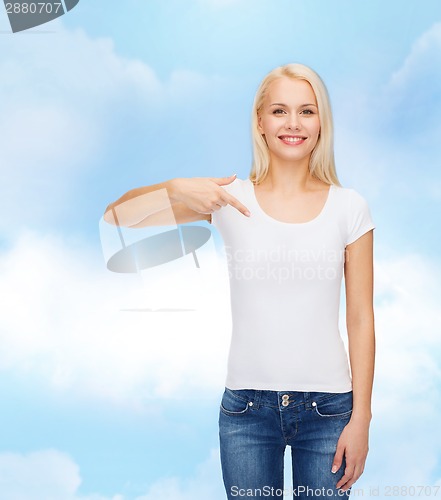 Image of smiling young woman in blank white t-shirt