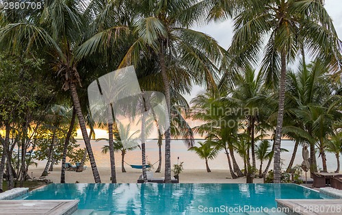 Image of swimming pool on tropical beach