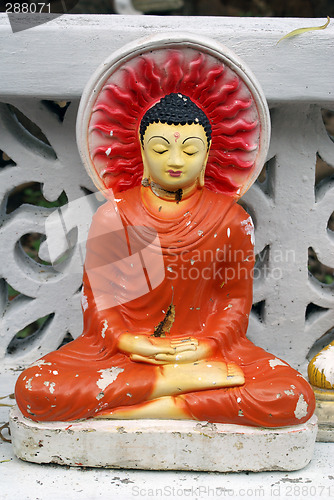 Image of Red Buddah under the tree