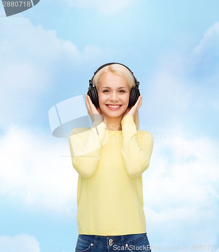 Image of smiling young woman with headphones