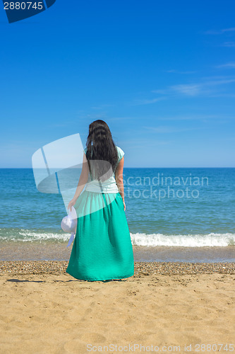 Image of Brunette with long hair on the beach