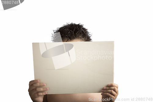 Image of Plywood sign held up by young hands