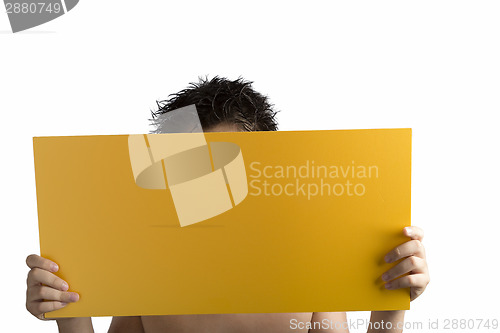 Image of Plywood yellow sign held up by hands