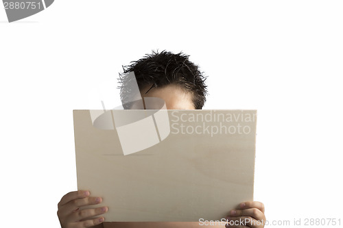 Image of Plywood sign held up by young hands