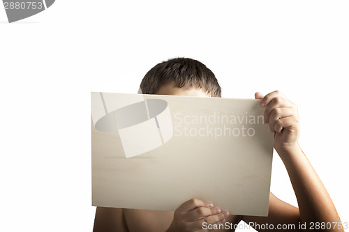 Image of Plywood sign held up by young hands