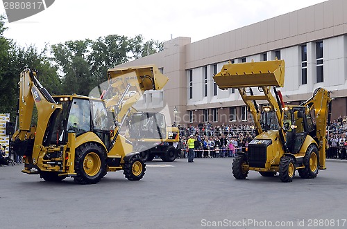 Image of City Day of Tyumen, on July 26, 2014, show of dancing excavators
