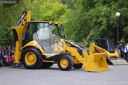 Image of City Day of Tyumen, on July 26, 2014, show of dancing excavators