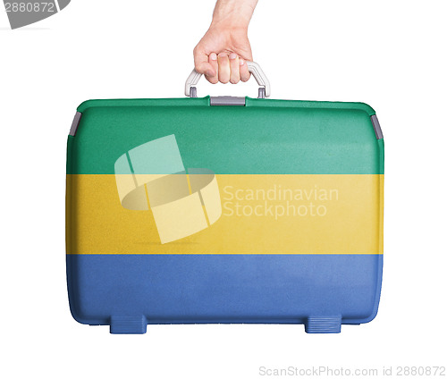 Image of Used plastic suitcase with stains and scratches