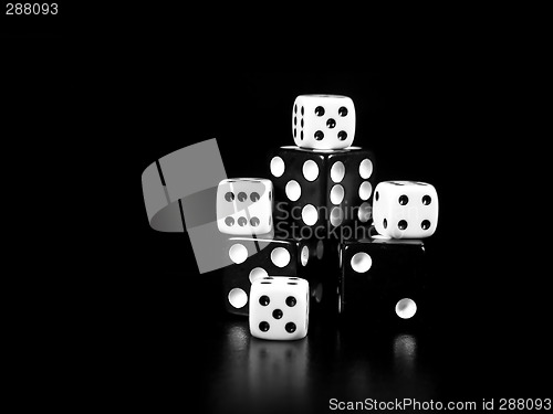 Image of Black And White Dice On Black Background
