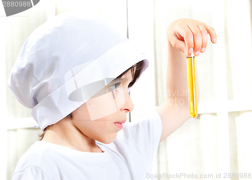 Image of Little boy doing biochemistry