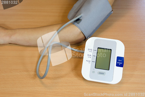 Image of female patient check measure her blood pressure 