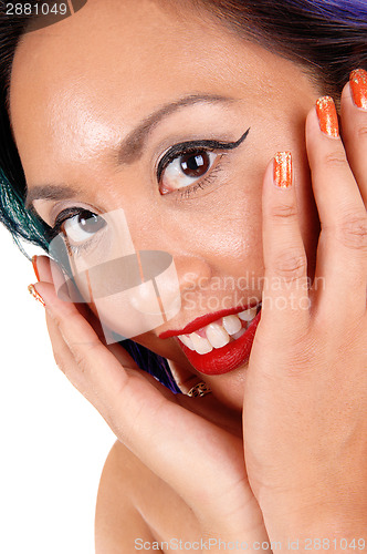 Image of Woman holding her face.