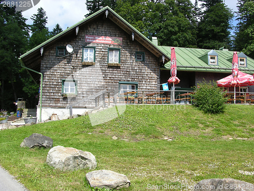 Image of Old bavarian guesthouse with clapboard storefront