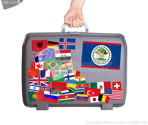 Image of Used plastic suitcase with stickers