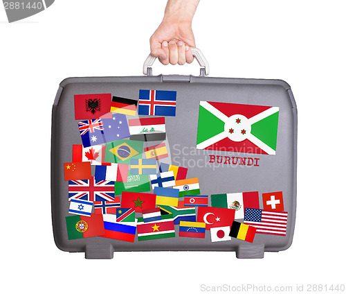 Image of Used plastic suitcase with stickers