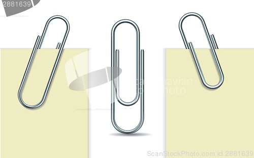 Image of Metal paperclip and paper